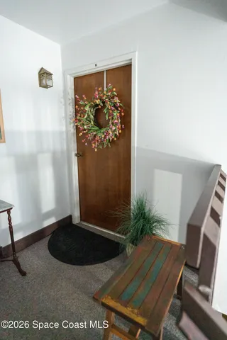 a view of a livingroom with furniture and hardwood floor