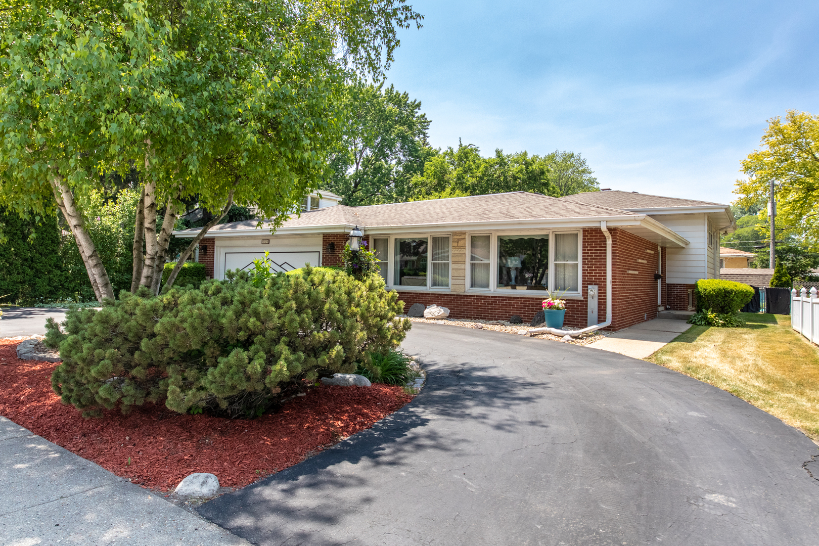 front view of a house with a garden