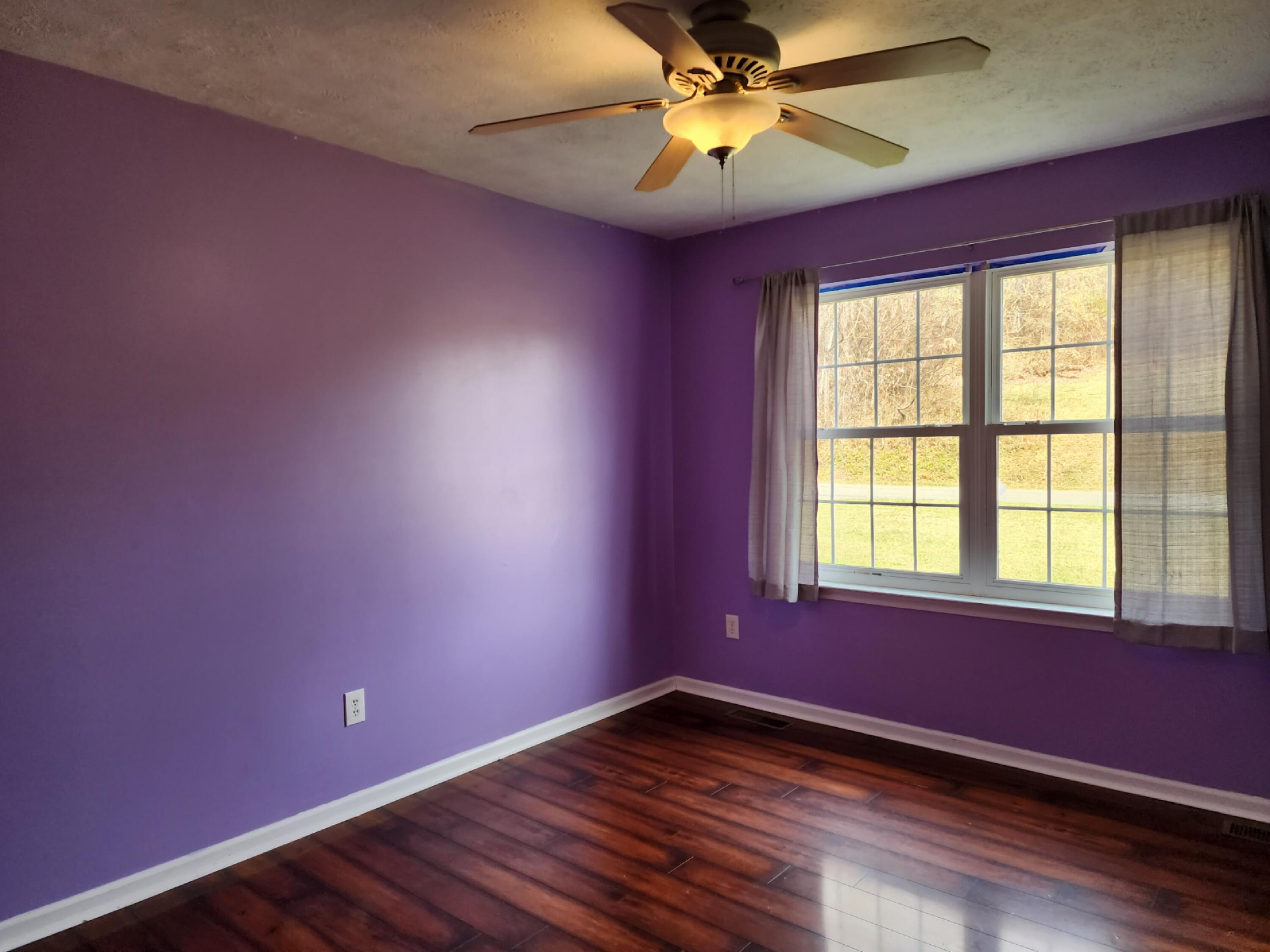 1189 Foothills Road Callaway, VA 24067 - Photo 12 of 21 a view of an empty room with window and wooden floor
