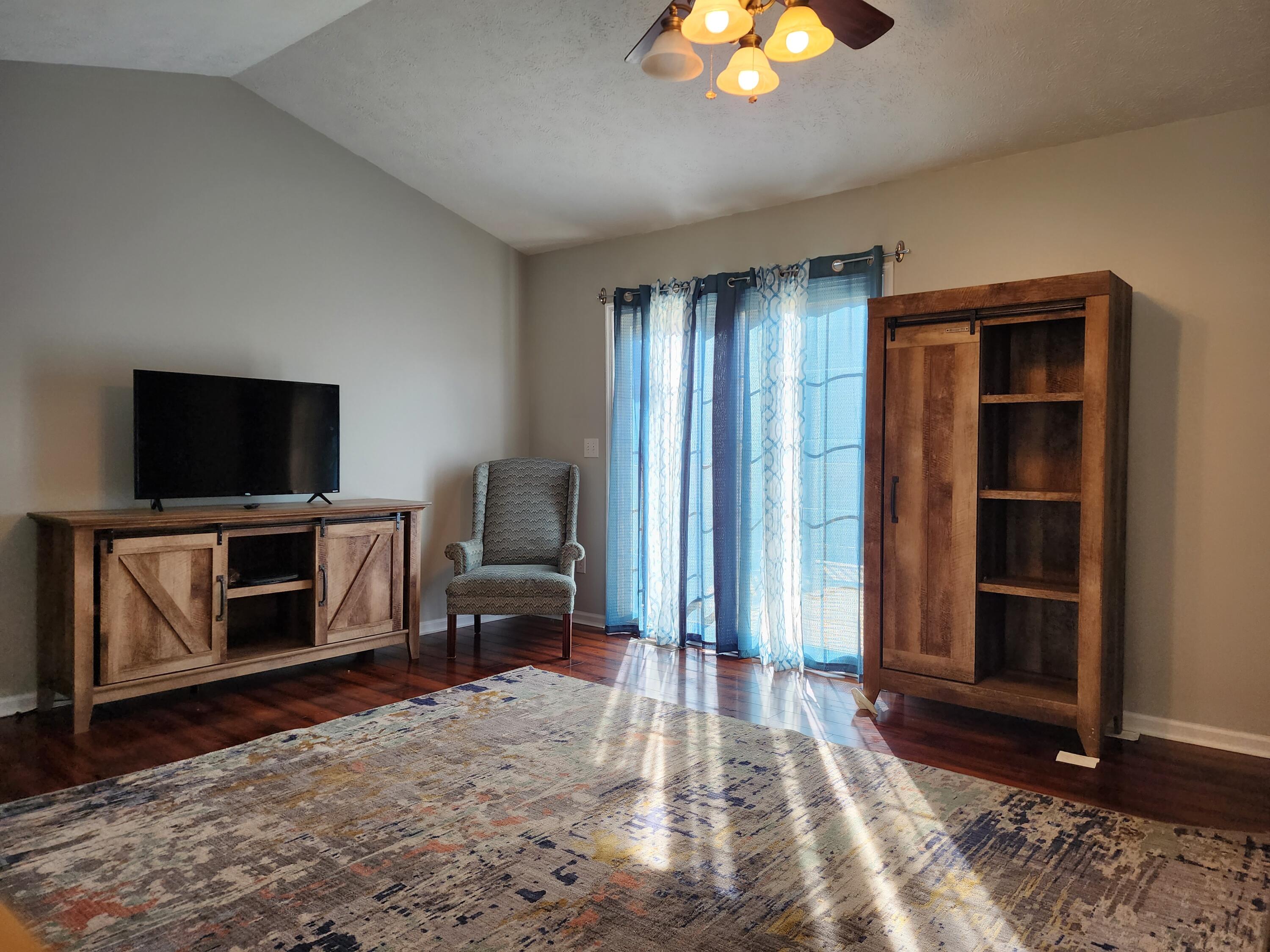 1189 Foothills Road Callaway, VA 24067 - Photo 9 of 21 a living room with furniture and a flat screen tv