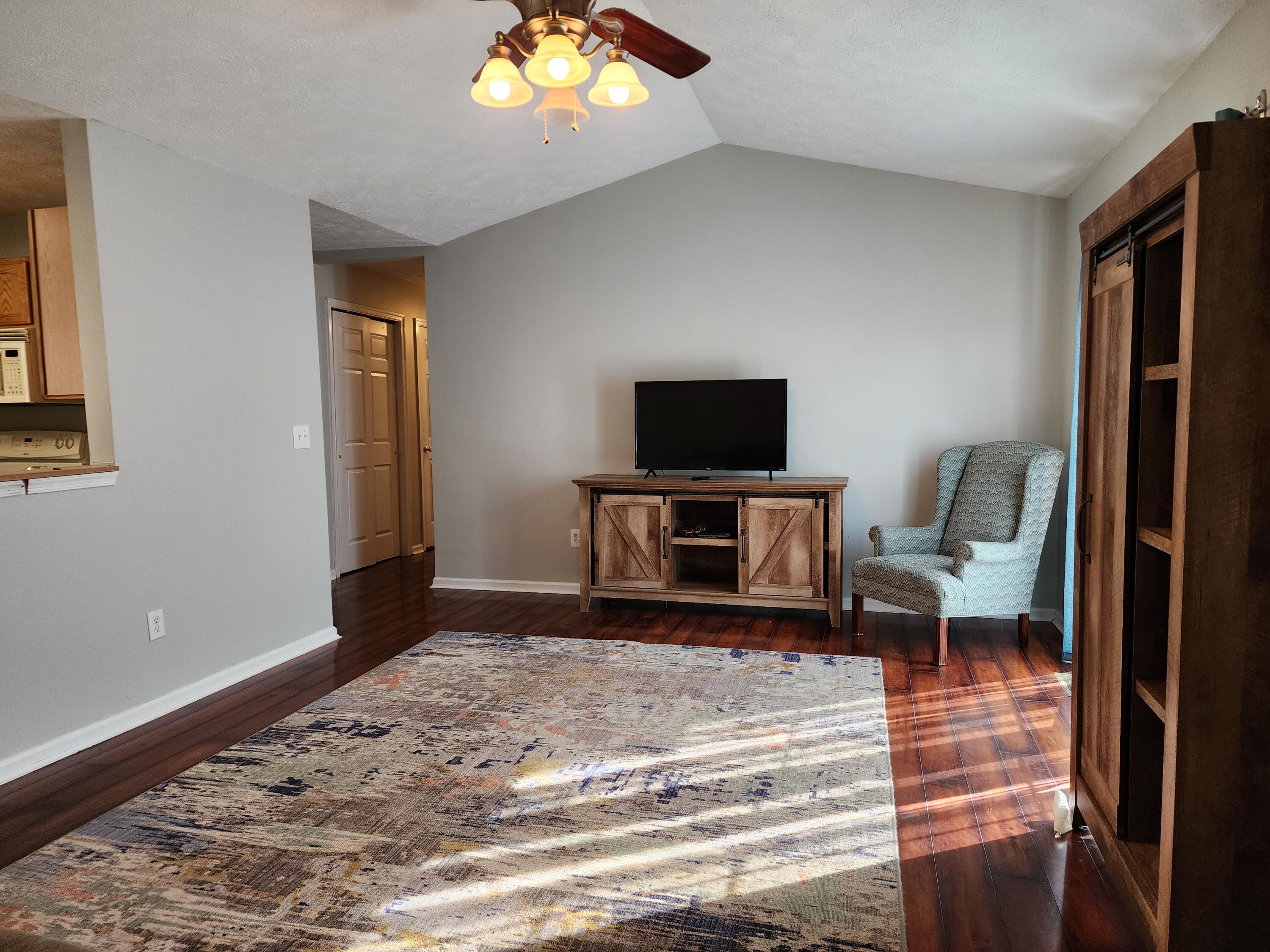 1189 Foothills Road Callaway, VA 24067 - Photo 10 of 21 a living room with furniture and a flat screen tv