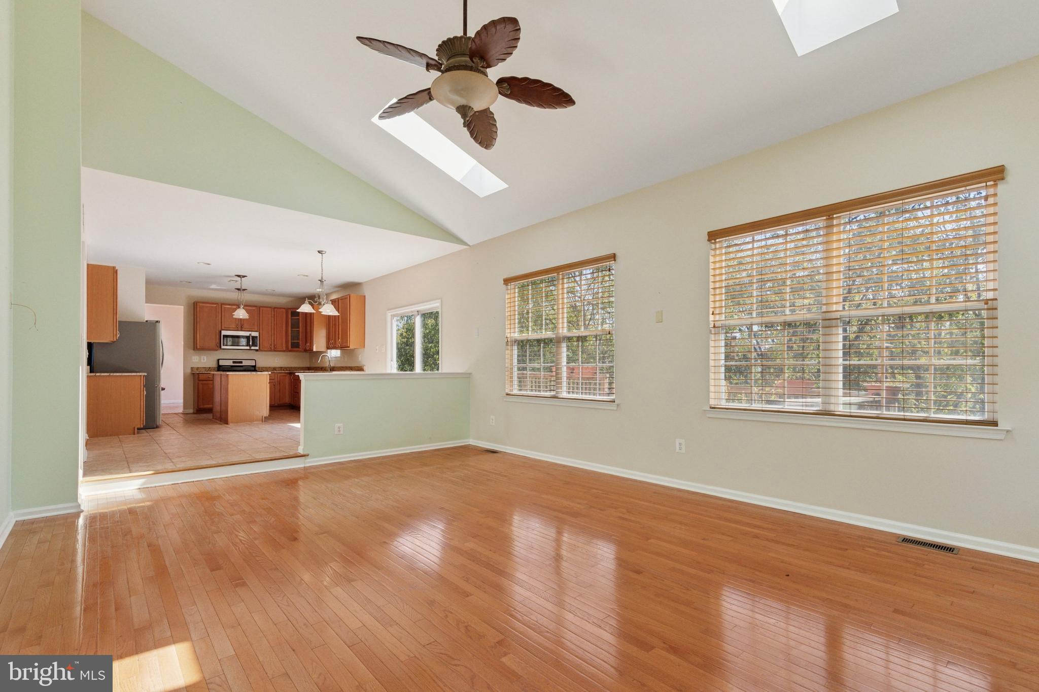 456 Windy Hill Road Gilbertsville, PA 19525 - Photo 13 of 46 a view of an empty room with a window and wooden floor