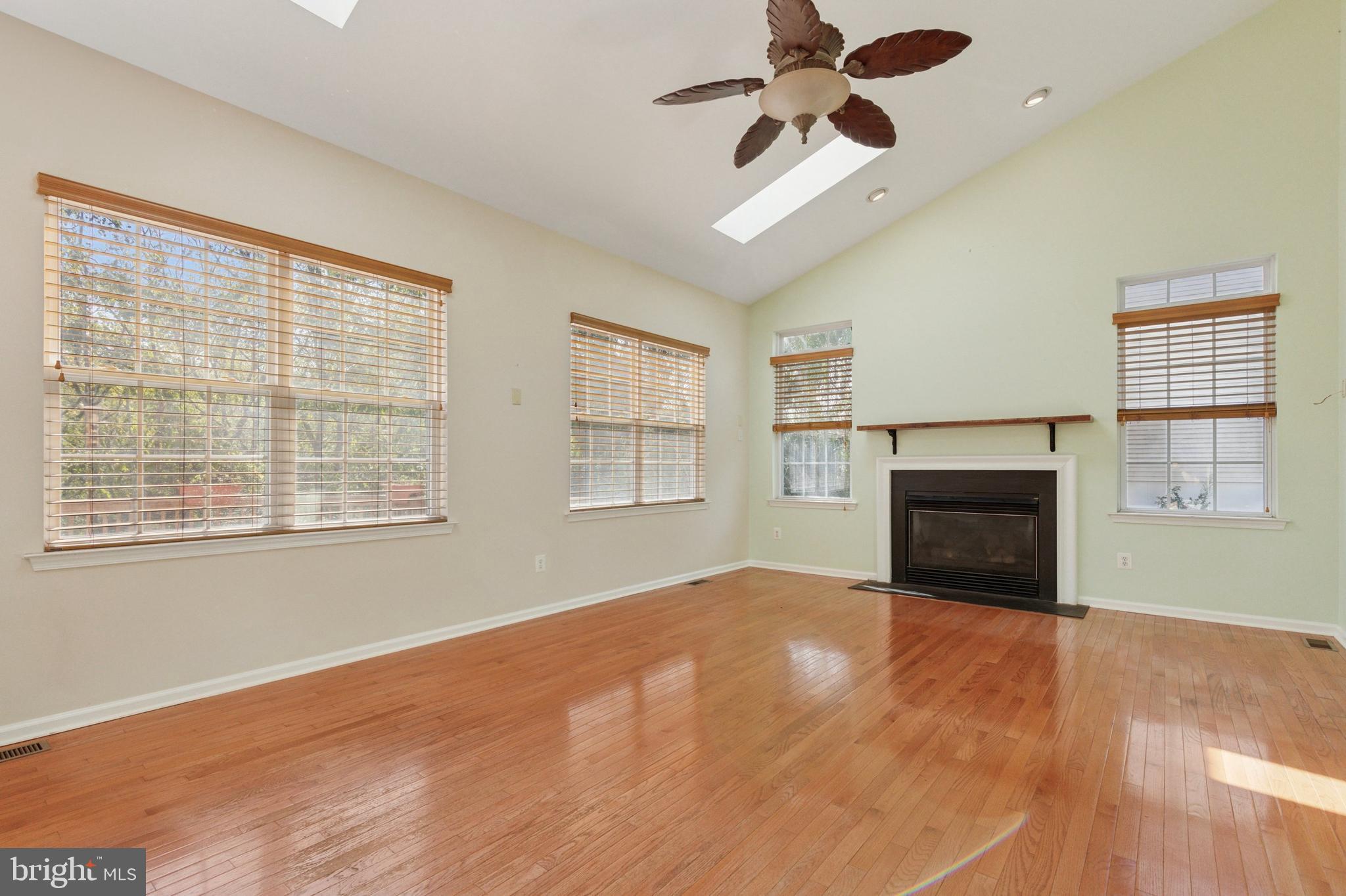 456 Windy Hill Road Gilbertsville, PA 19525 - Photo 14 of 46 a view of an empty room with a window and a fireplace