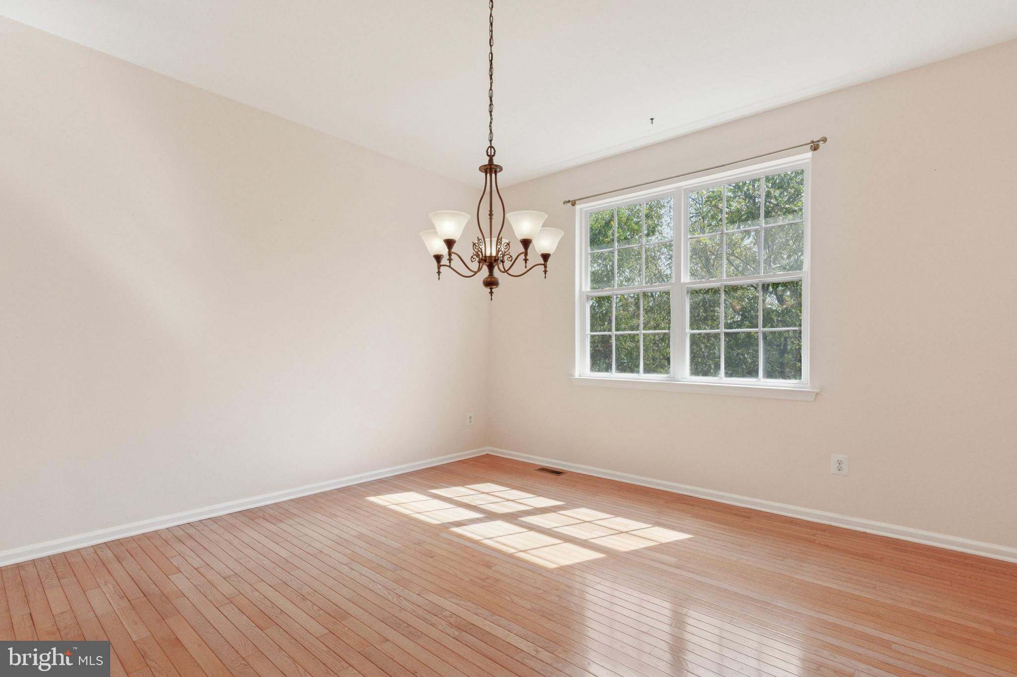 456 Windy Hill Road Gilbertsville, PA 19525 - Photo 18 of 46 a view of empty room with wooden floor and fan