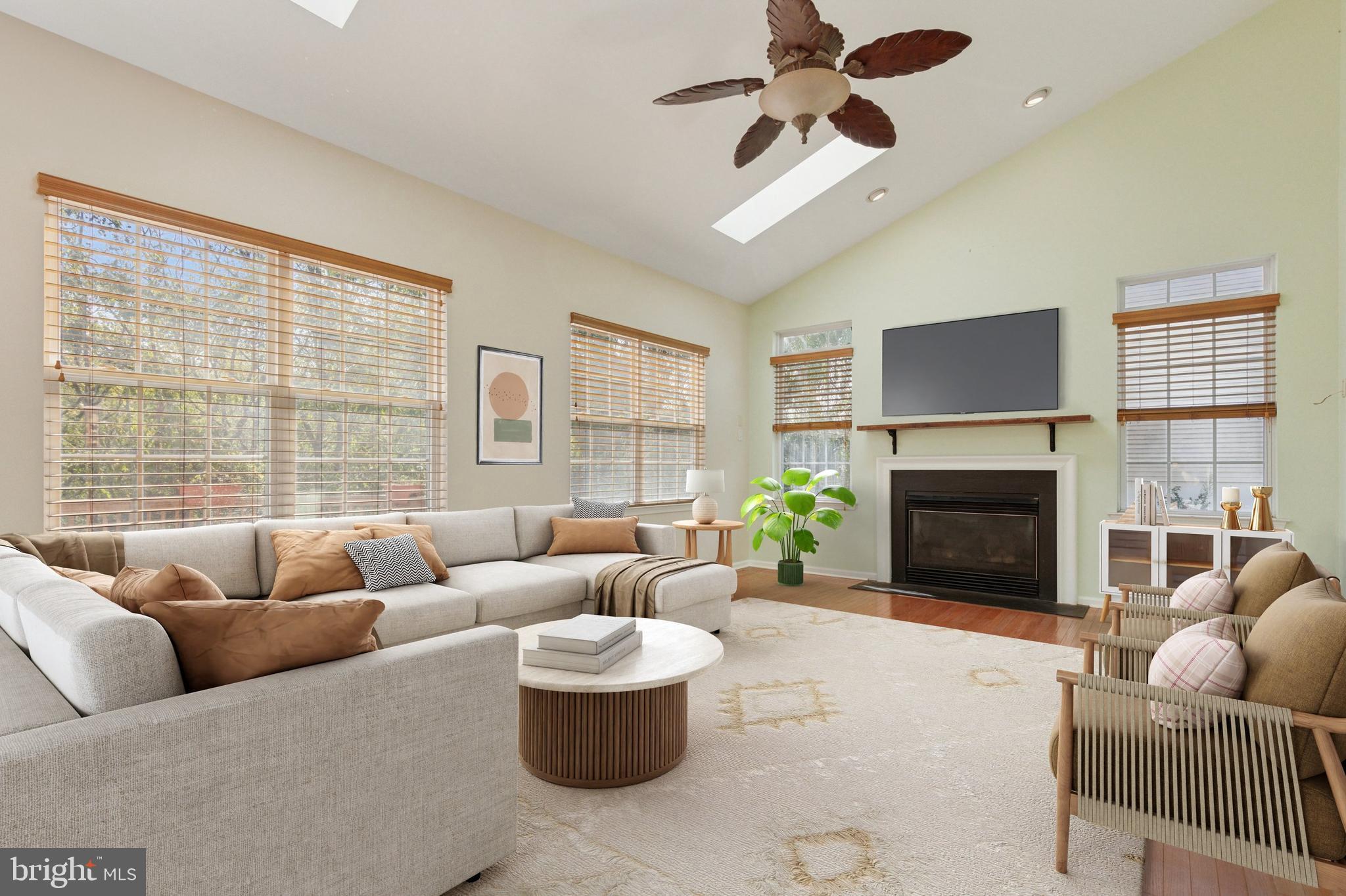 456 Windy Hill Road Gilbertsville, PA 19525 - Photo 2 of 46 a living room with furniture a fireplace and a large window