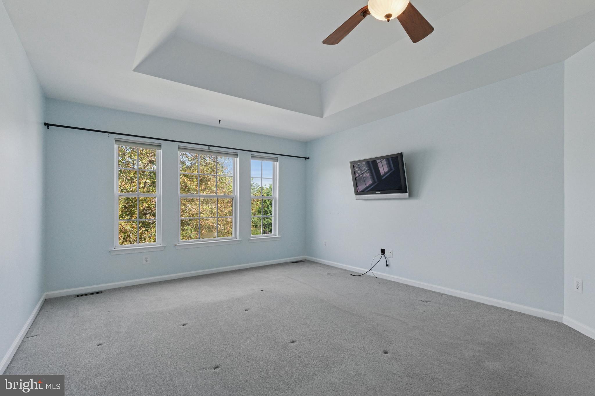 456 Windy Hill Road Gilbertsville, PA 19525 - Photo 23 of 46 an empty room with ceiling fan and window