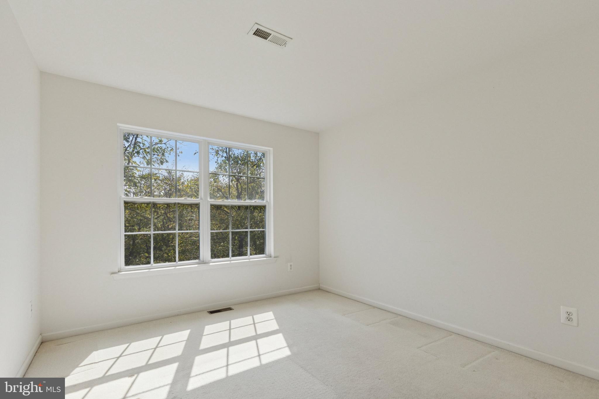 456 Windy Hill Road Gilbertsville, PA 19525 - Photo 28 of 46 a view of an empty room with a window