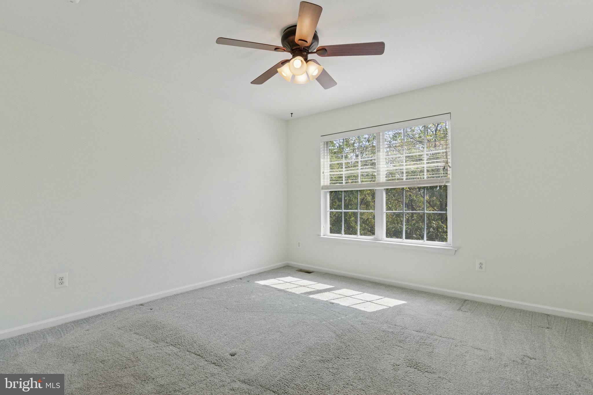 456 Windy Hill Road Gilbertsville, PA 19525 - Photo 31 of 46 an empty room with a window and a fan
