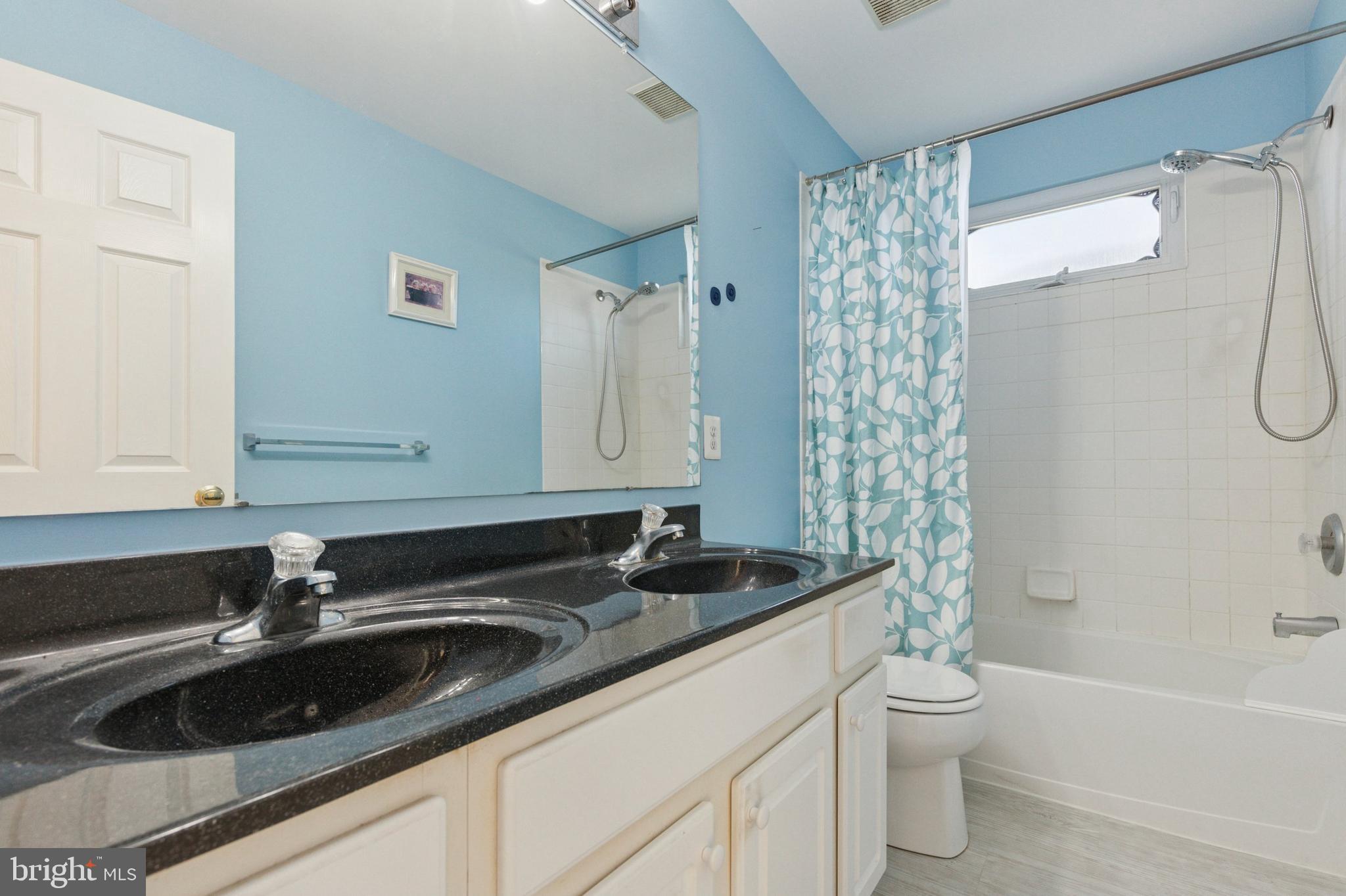 456 Windy Hill Road Gilbertsville, PA 19525 - Photo 33 of 46 a bathroom with a sink a toilet and shower