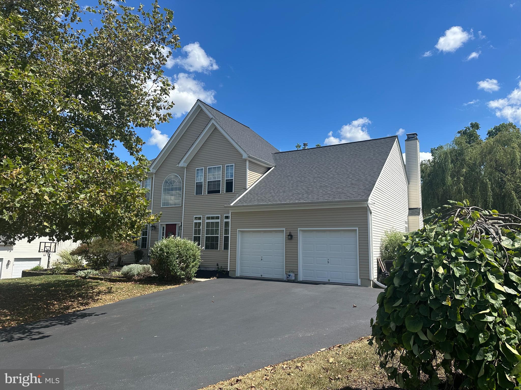456 Windy Hill Road Gilbertsville, PA 19525 - Photo 43 of 46 a front view of a house with a yard and garage