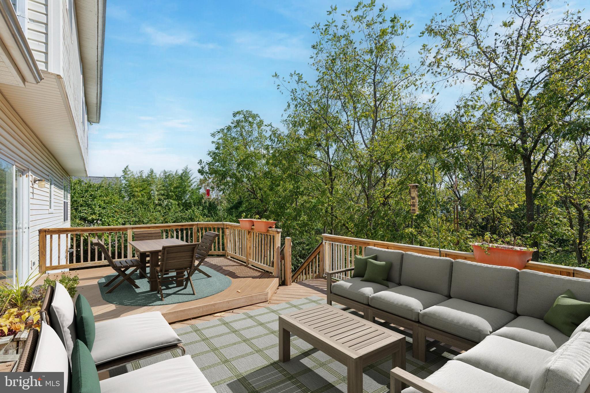 456 Windy Hill Road Gilbertsville, PA 19525 - Photo 8 of 46 a view of a patio with couches chairs and wooden floor