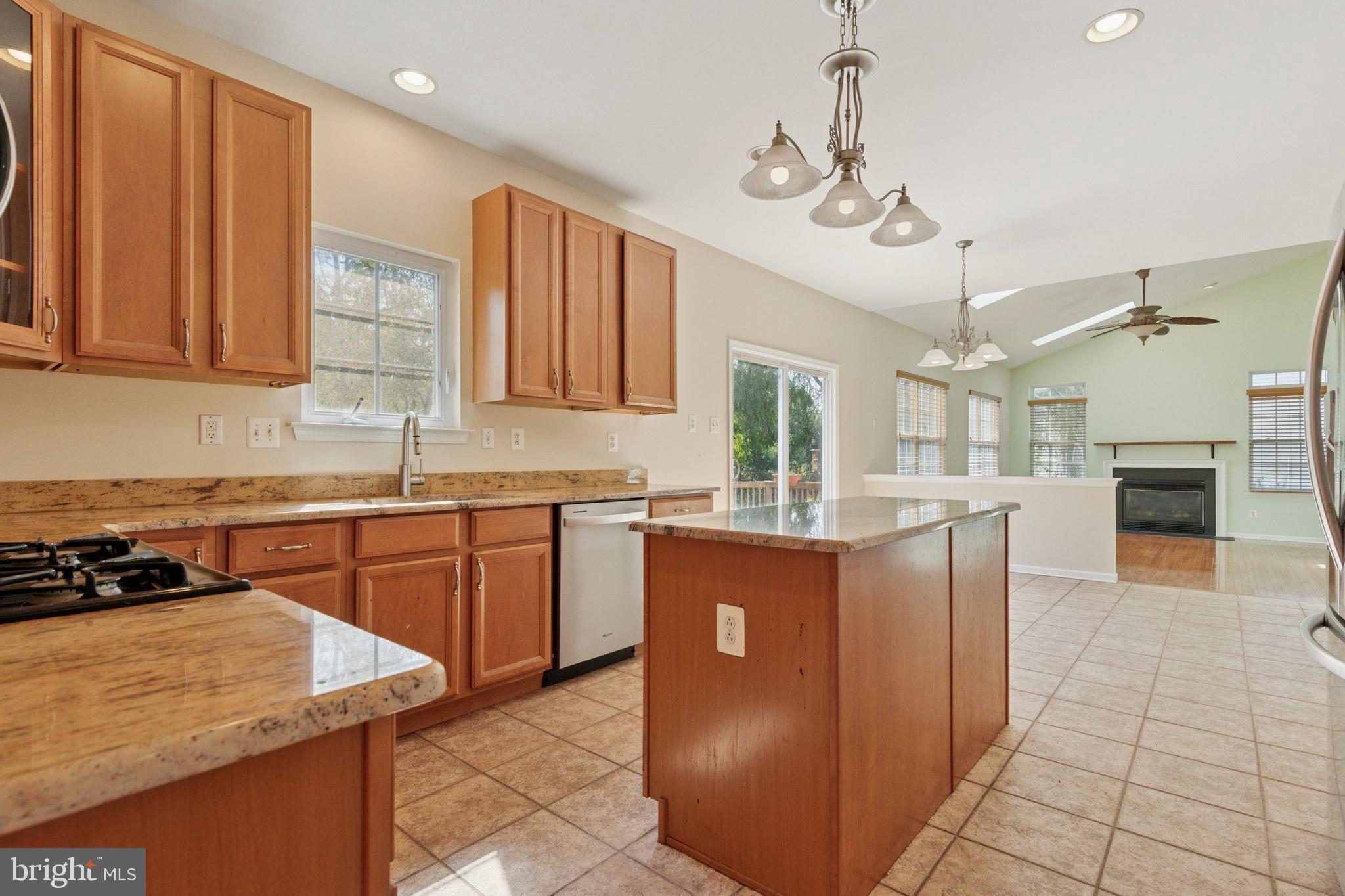 456 Windy Hill Road Gilbertsville, PA 19525 - Photo 9 of 46 a kitchen with cabinets a sink a window and stainless steel appliances