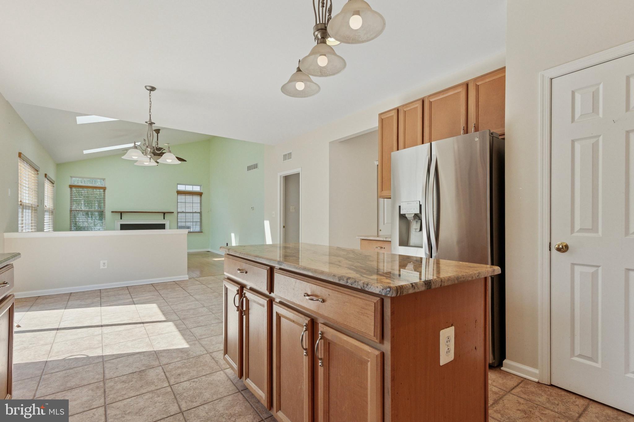456 Windy Hill Road Gilbertsville, PA 19525 - Photo 10 of 46 a kitchen with stainless steel appliances granite countertop a refrigerator and a sink