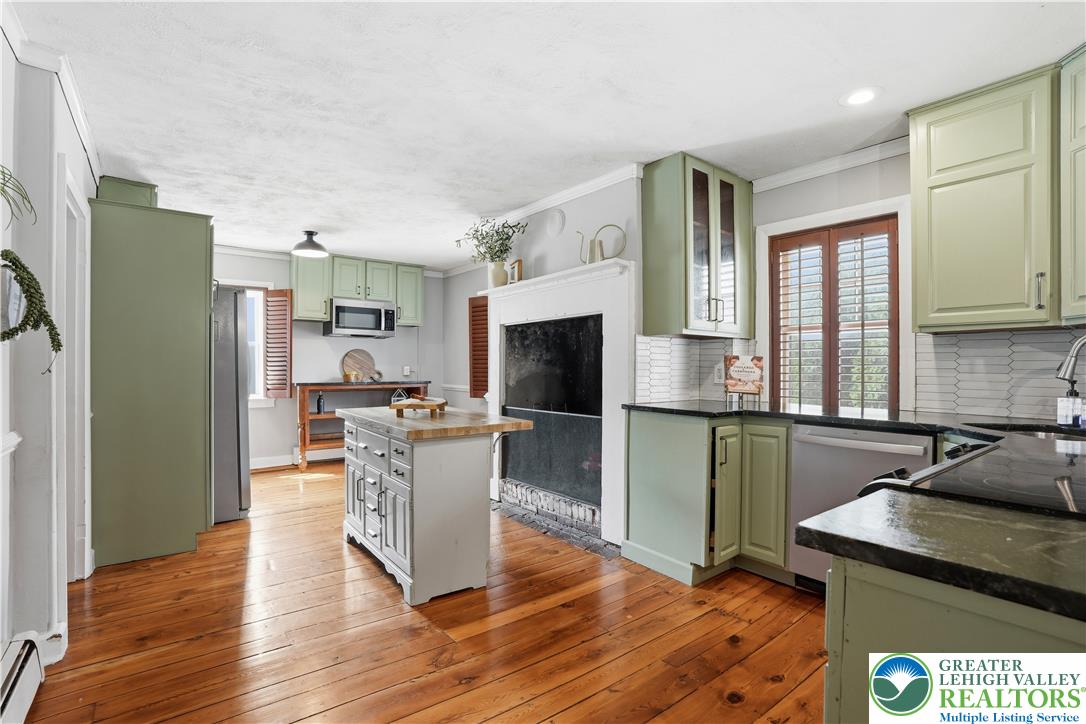 2014 Linden Street Bethlehem, PA 18017 - Photo 23 of 85 Hearty wooden floors stretch across this kitchen, offering plentiful counter space and a central island.