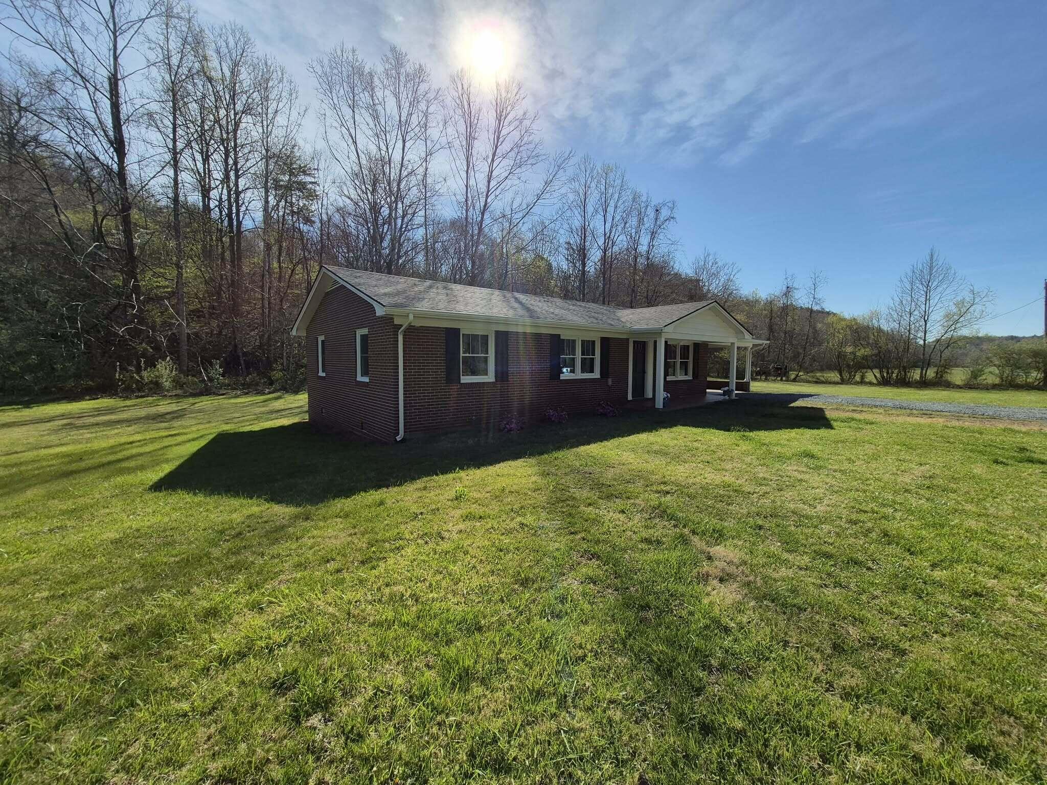 1232 Prillaman Switch Road Ferrum, VA 24088 - Photo 47 of 50 a view of a house with a yard