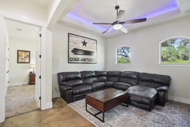 a living room with furniture and a window