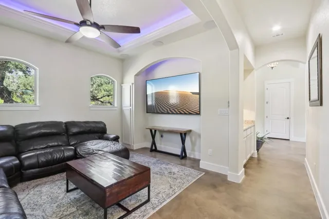 a living room with furniture and a flat screen tv
