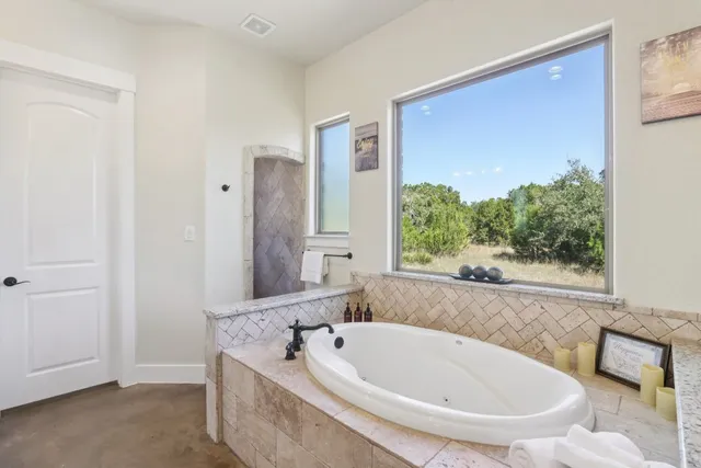 a bathroom with a tub and sink