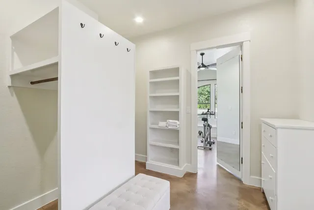 a view of an empty room with a closet