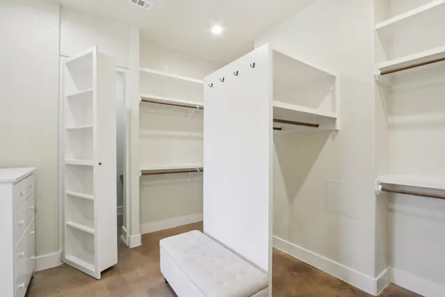 a view of an empty walk in closet