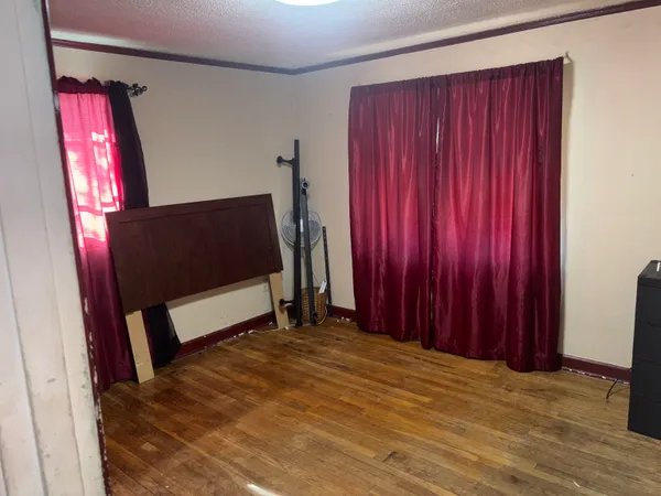 a view of a room with furniture and a window