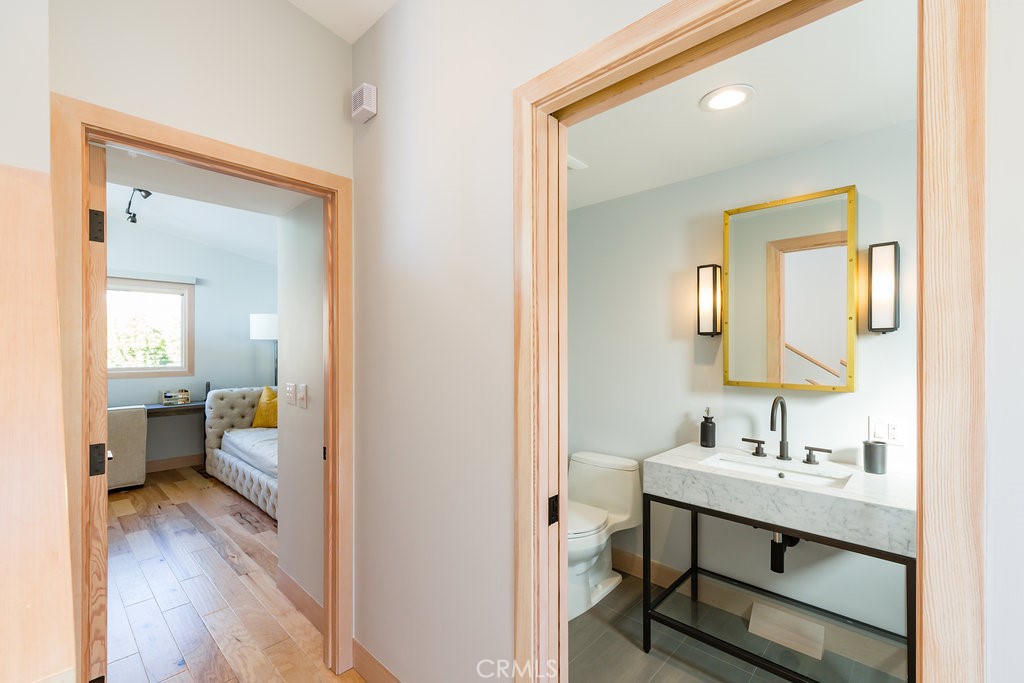 814 Monterey Boulevard Hermosa Beach, CA 90254 - Photo 14 of 28 a bathroom with a sink mirror and a toilet