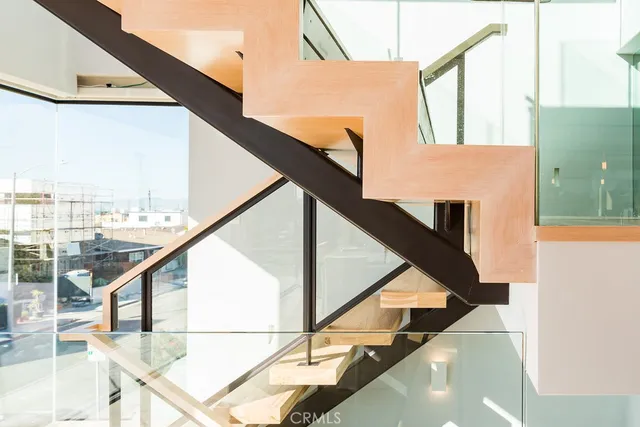 a view of balcony with wooden floor and a potted plant