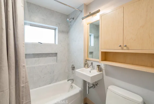 a bathroom with a sink and a bathtub