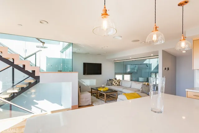 a view of a livingroom with furniture and a flat screen tv
