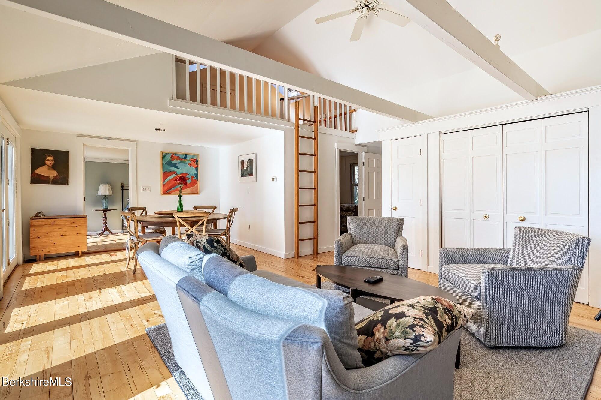 7 Point Road Monterey, MA 01245 - Photo 13 of 41 a living room with furniture and a chandelier