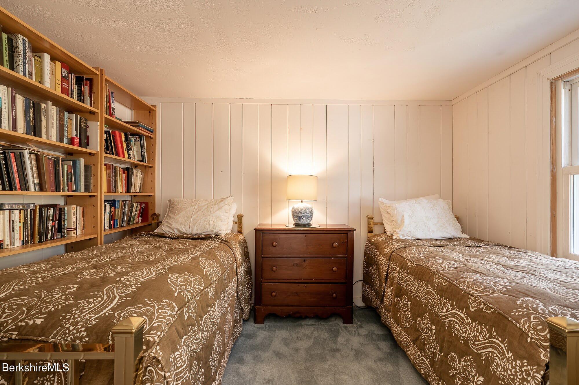 7 Point Road Monterey, MA 01245 - Photo 20 of 41 a bedroom with a bed and a book shelf