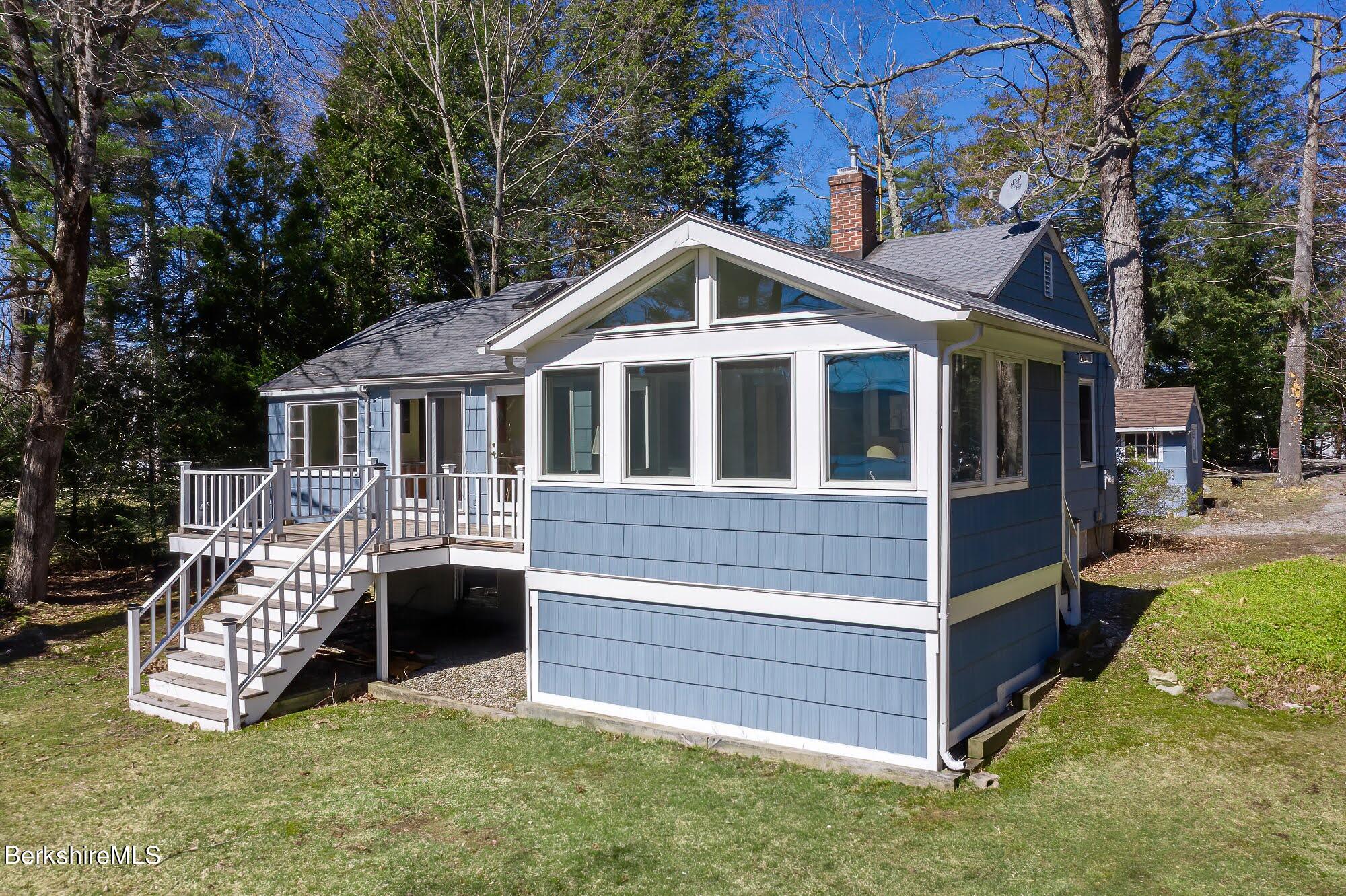 7 Point Road Monterey, MA 01245 - Photo 31 of 41 a front view of a house with garden