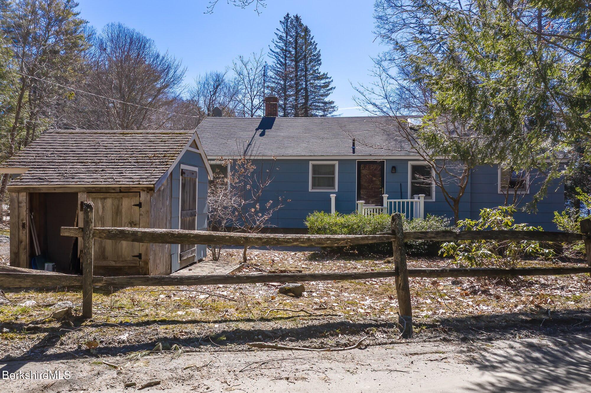 7 Point Road Monterey, MA 01245 - Photo 41 of 41 a front view of a house with garden