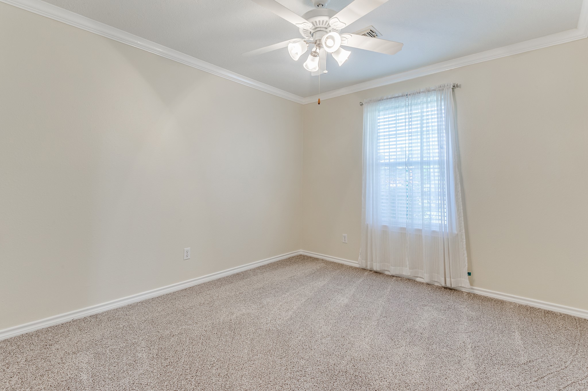 341 Sam Houston Loop Point Blank, TX 77364 - Photo 20 of 36 an empty room with a window and a fan