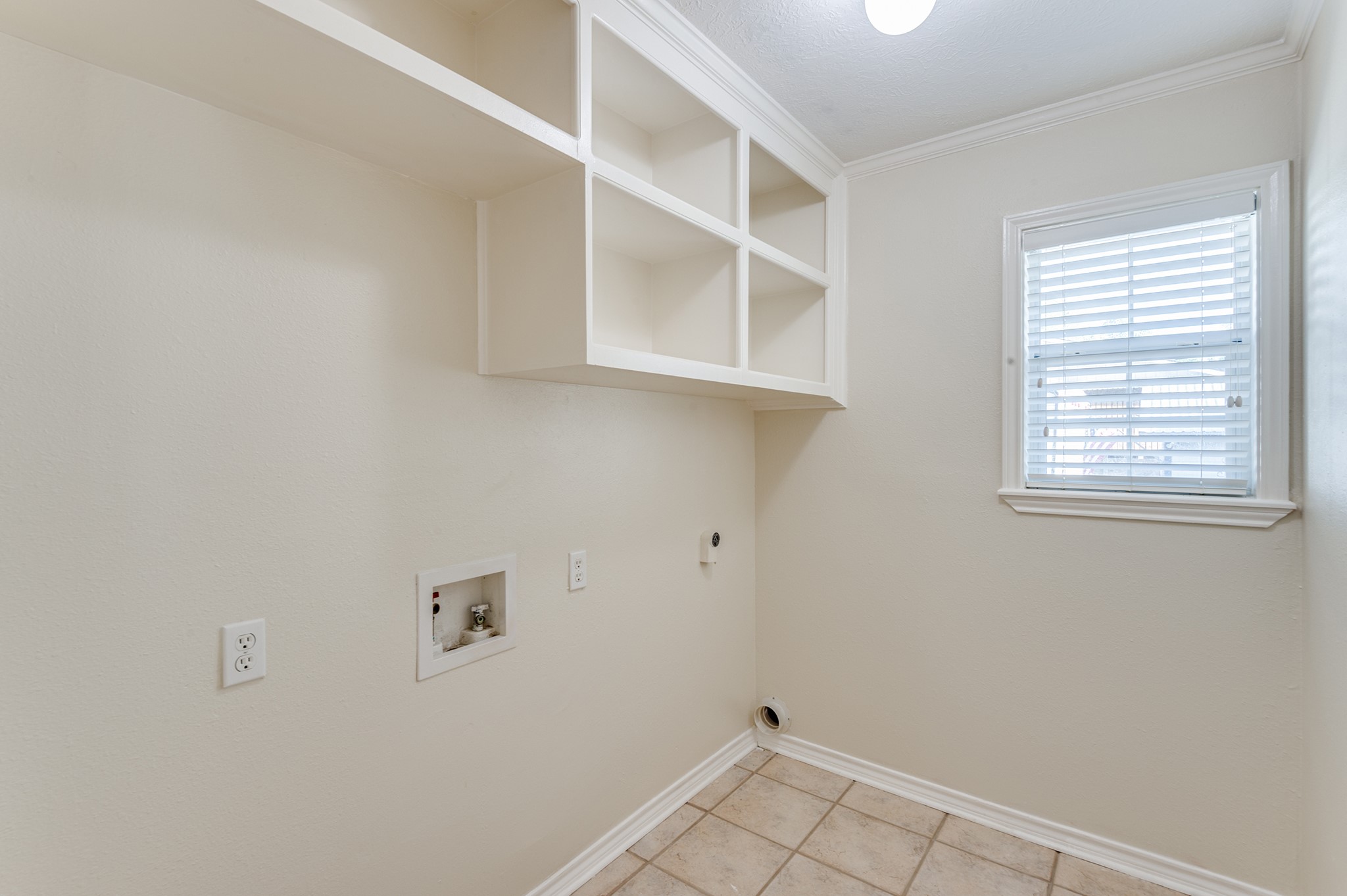 341 Sam Houston Loop Point Blank, TX 77364 - Photo 23 of 36 an empty room with a window