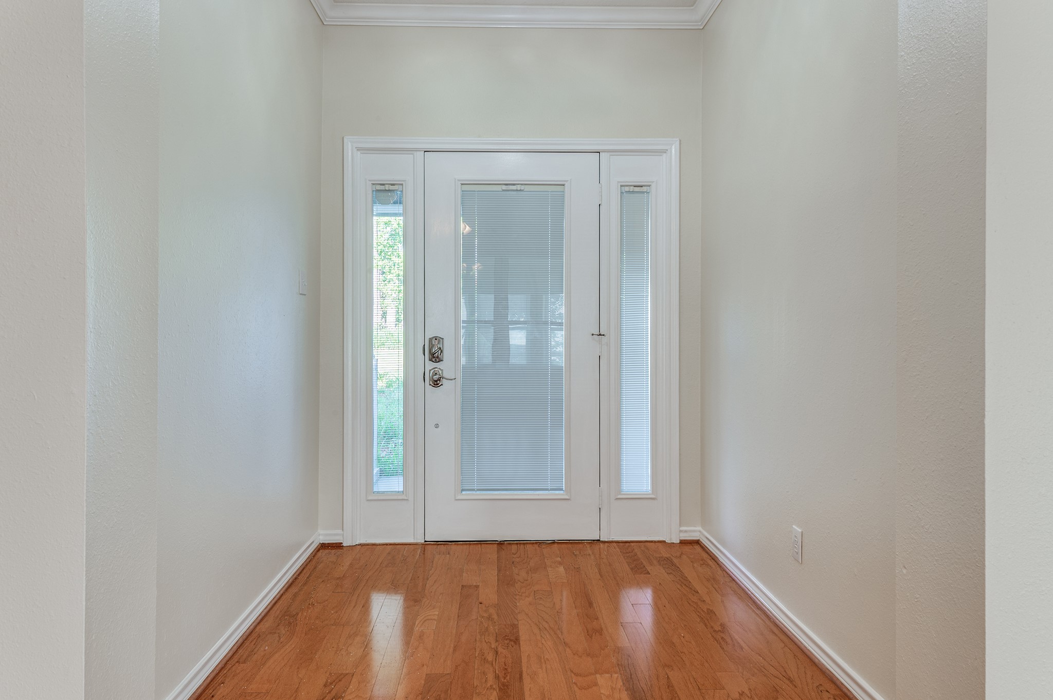 341 Sam Houston Loop Point Blank, TX 77364 - Photo 3 of 36 a view of a small space with wooden floor and a window
