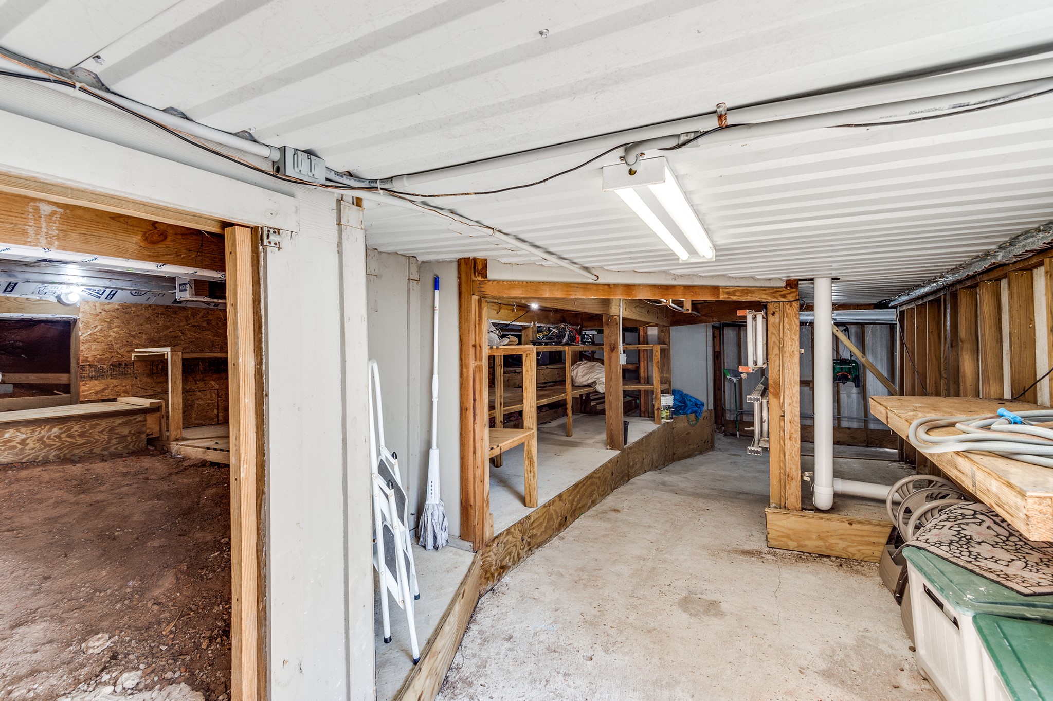 341 Sam Houston Loop Point Blank, TX 77364 - Photo 31 of 36 a view of a hallway with wooden walls
