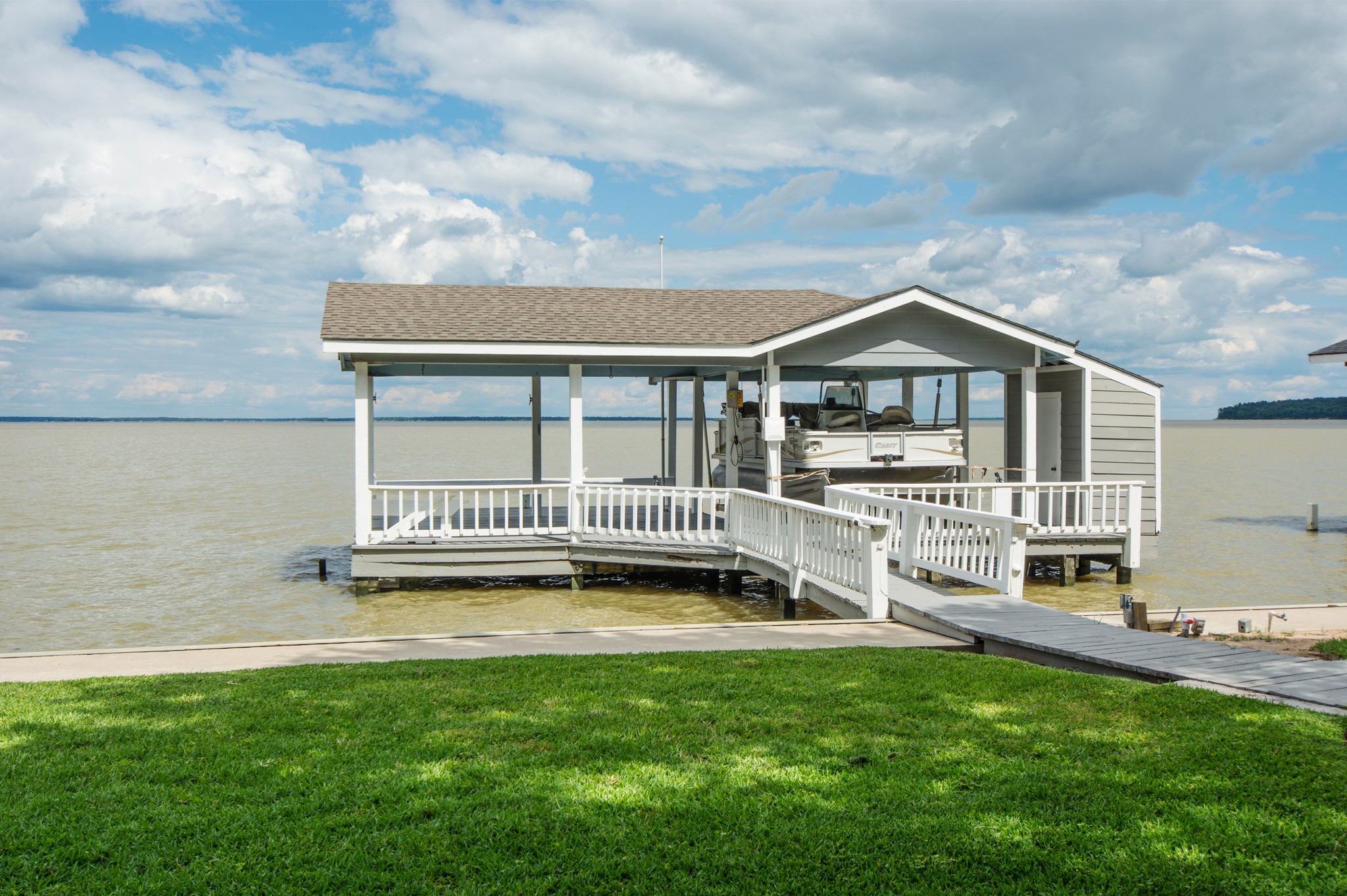 341 Sam Houston Loop Point Blank, TX 77364 - Photo 33 of 36 a view of a house with a yard and a fountain