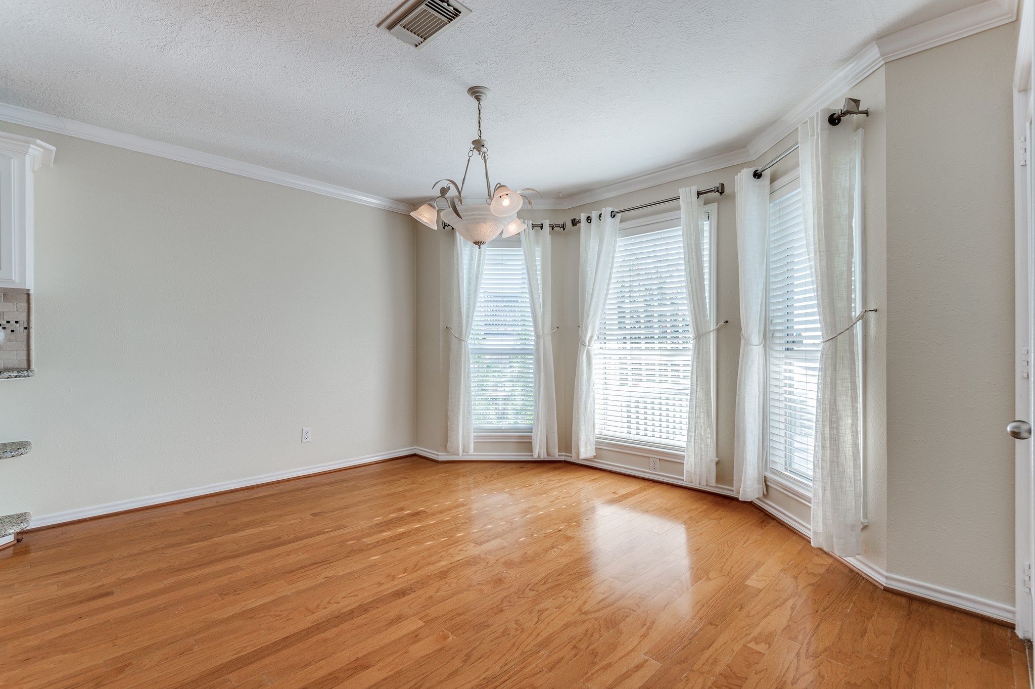 341 Sam Houston Loop Point Blank, TX 77364 - Photo 8 of 36 a view of livingroom with hardwood floor and window