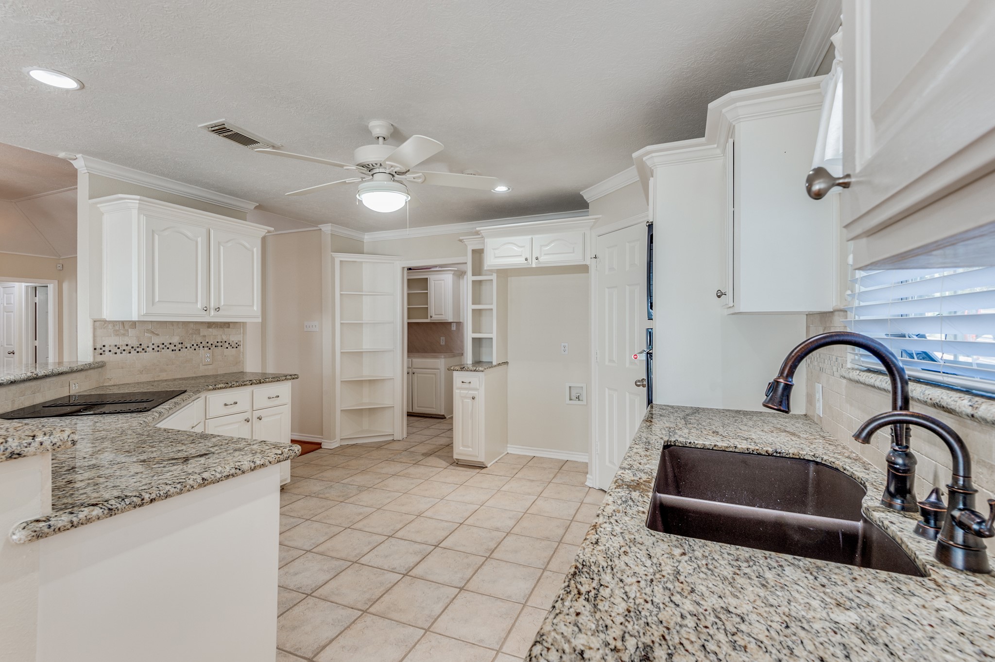 341 Sam Houston Loop Point Blank, TX 77364 - Photo 10 of 36 a kitchen with stainless steel appliances granite countertop a sink a refrigerator and a stove