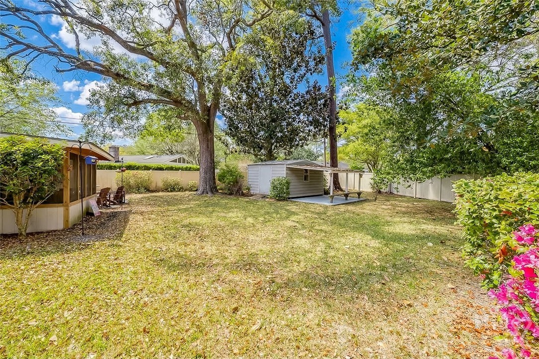 12606 Sunnybrook Road Savannah, GA 31419 - Photo 32 of 39 This large backyard is surrounded by a cream colored PVC privacy fence.
