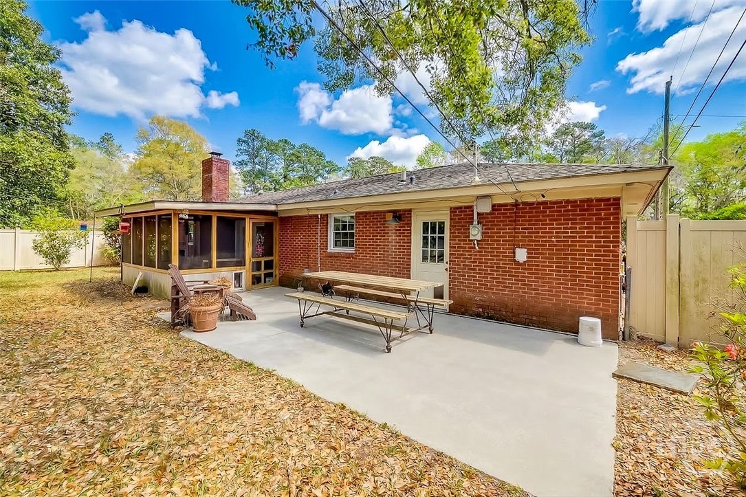 12606 Sunnybrook Road Savannah, GA 31419 - Photo 34 of 39 Again, this home is perfect for entertaining with this huge open patio and the screened porch