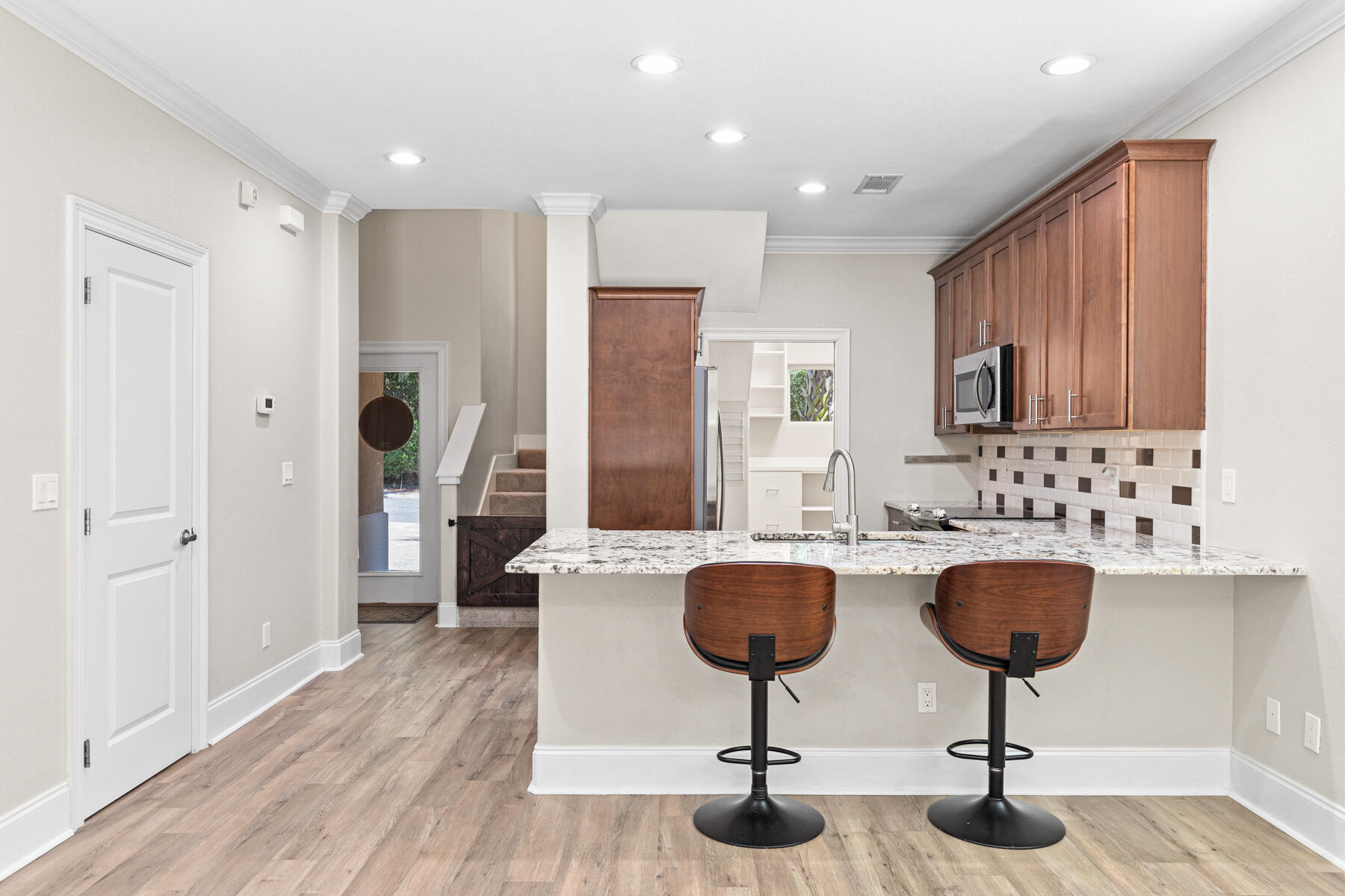 496 Soundview Court Mary Esther, FL 32569 - Photo 6 of 40 a kitchen with sink refrigerator and stove