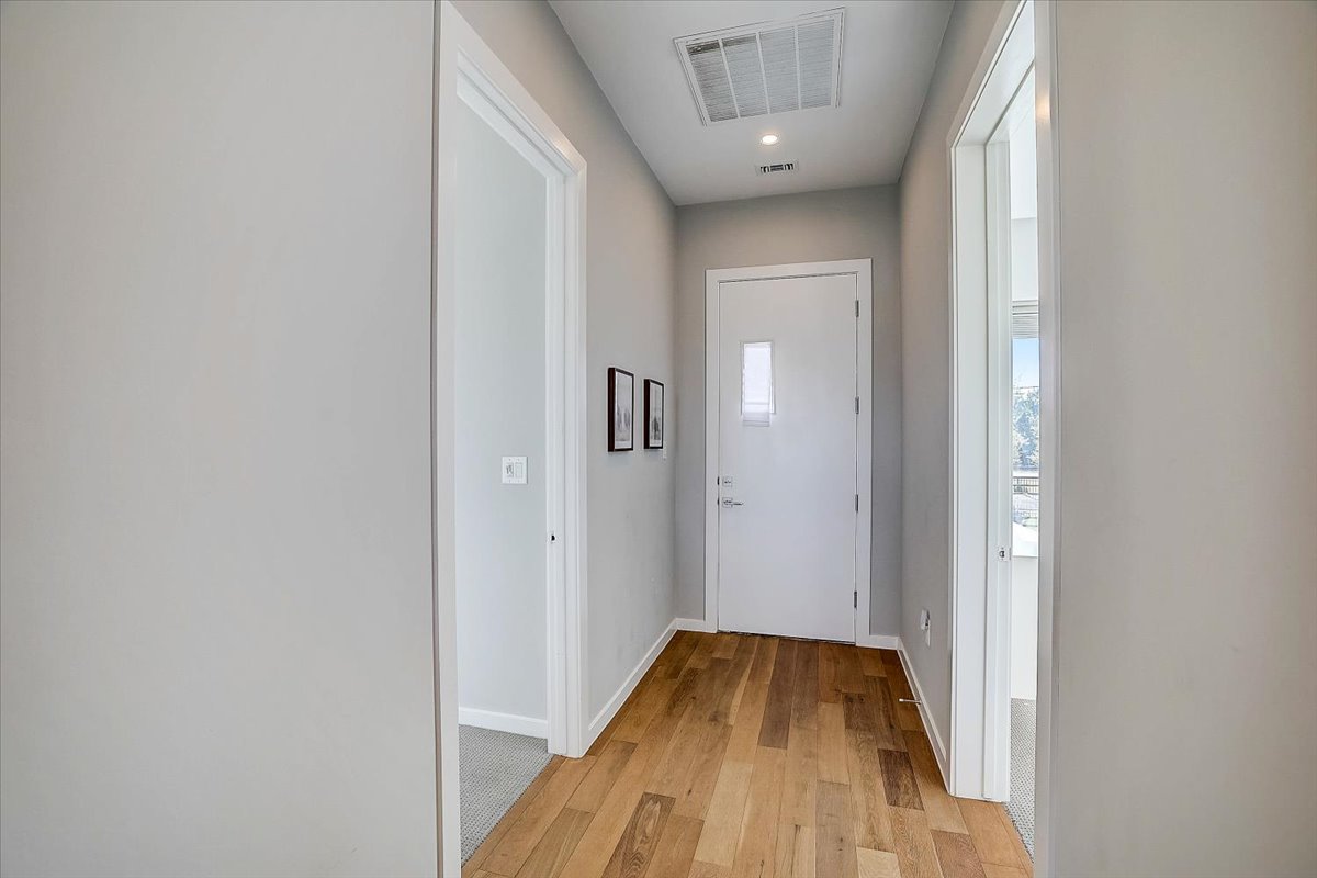 5921 Hiline Road, Unit 1204 Austin, TX 78734 - Photo 3 of 36 Entryway with hardwood / wood-style floors and recessed lighting