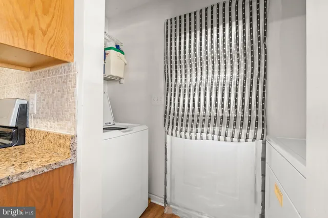 a view of a kitchen from the hallway