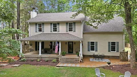 a view of house and outdoor space with swimming pool