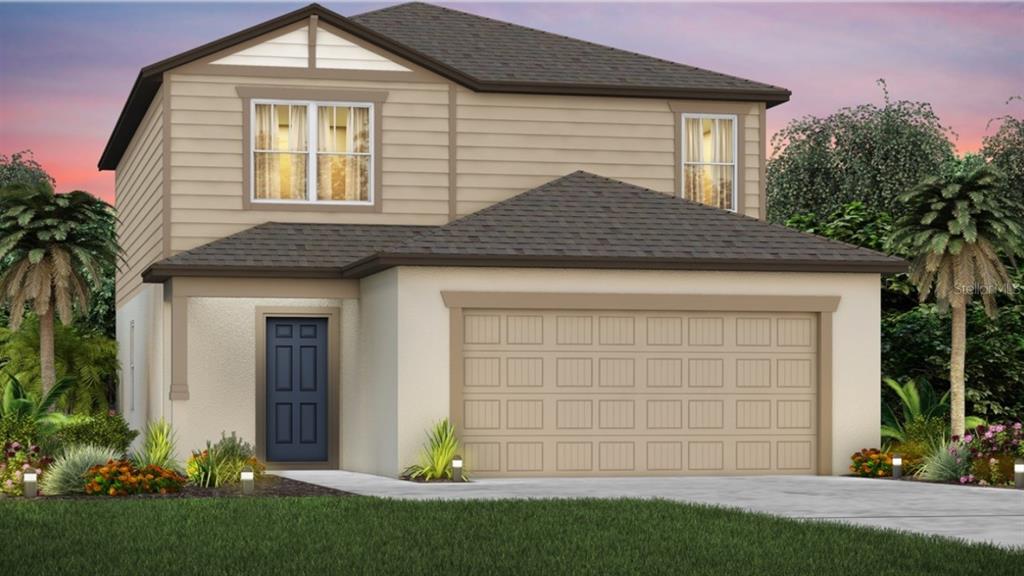9621 Rally Spring Loop Wesley Chapel, FL 33545 - Photo 1 of 1 a front view of a house with a garden and plants