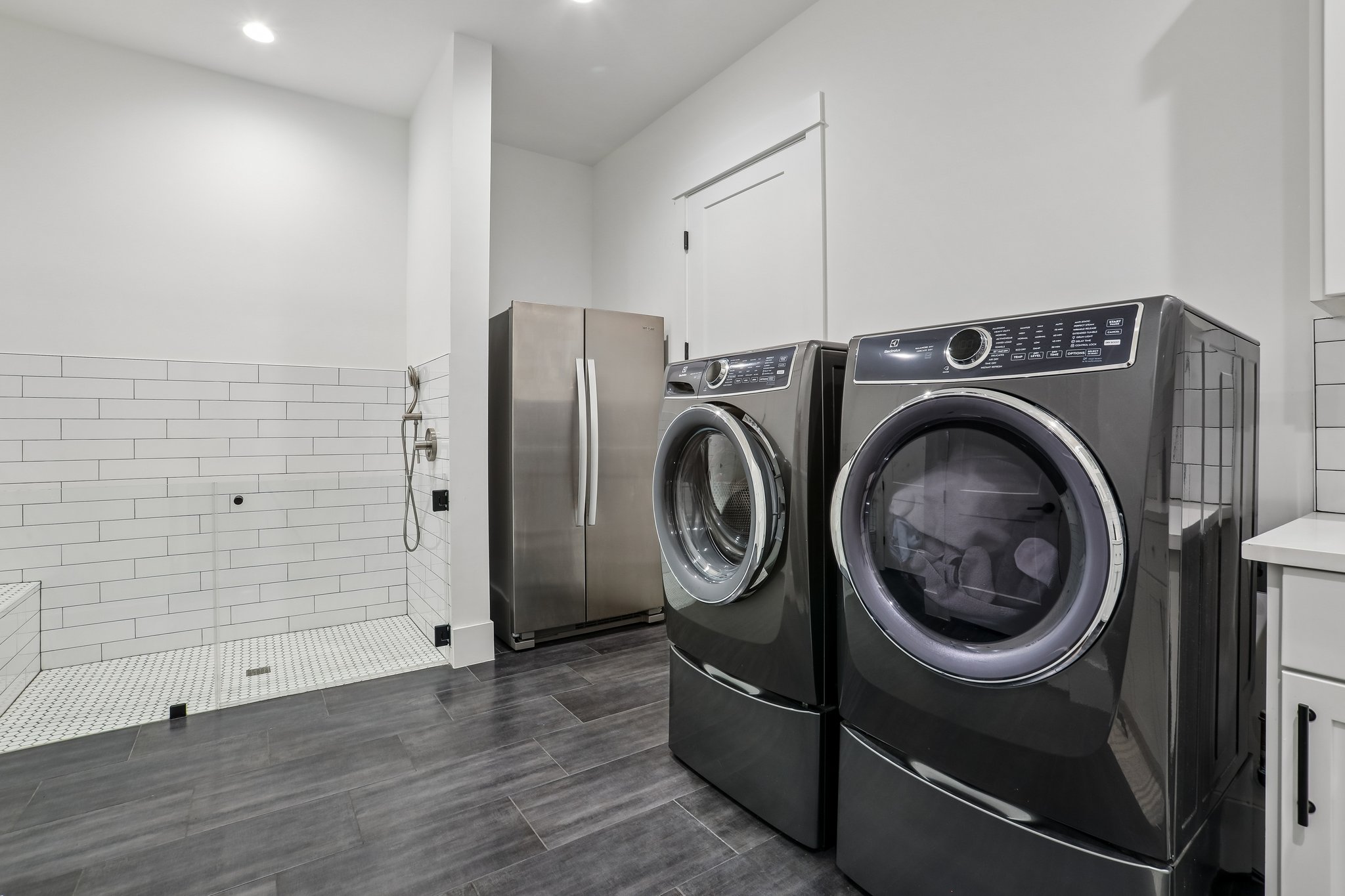 7309 Davenport Divide Road Austin, TX 78738 - Photo 16 of 30 A thoughtfully designed laundry room with a dedicated pet washing station.