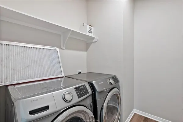 a utility room with dryer and washer
