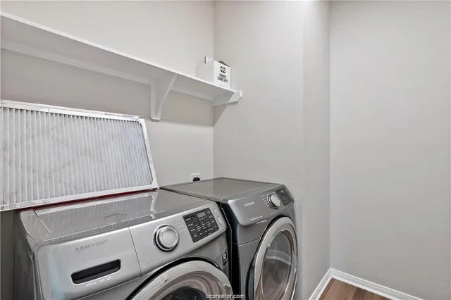 a utility room with dryer and washer